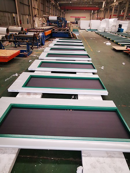 Wall panel production for flat pack container house